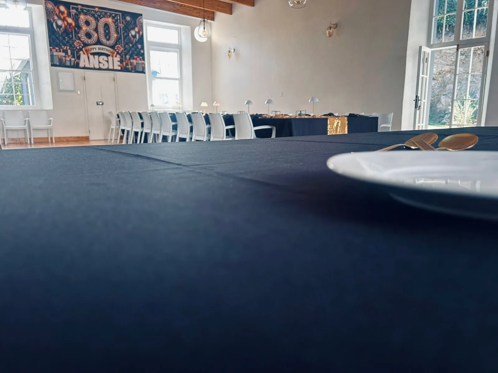 The hall laid in black and gold for an 80th birthday